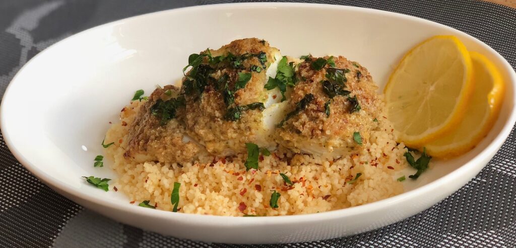 cous cous with halibut and parsley topping