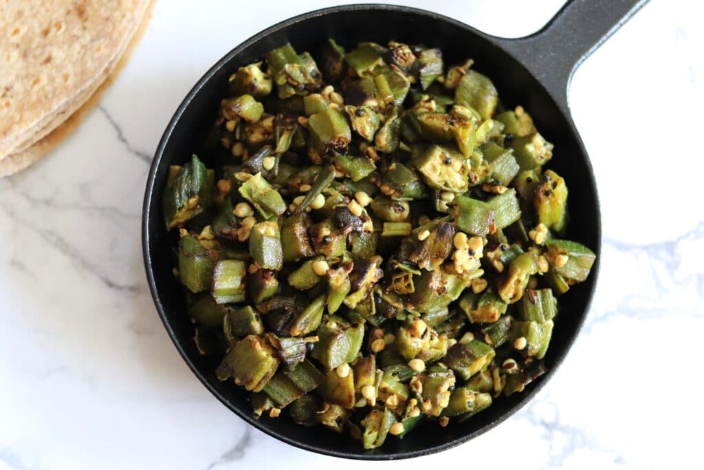 Finely chopped okra with turmeric mustard seeds and cumin seeds