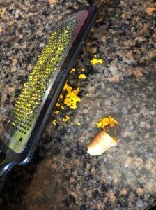 grated turmeric with a microplane showing the end result