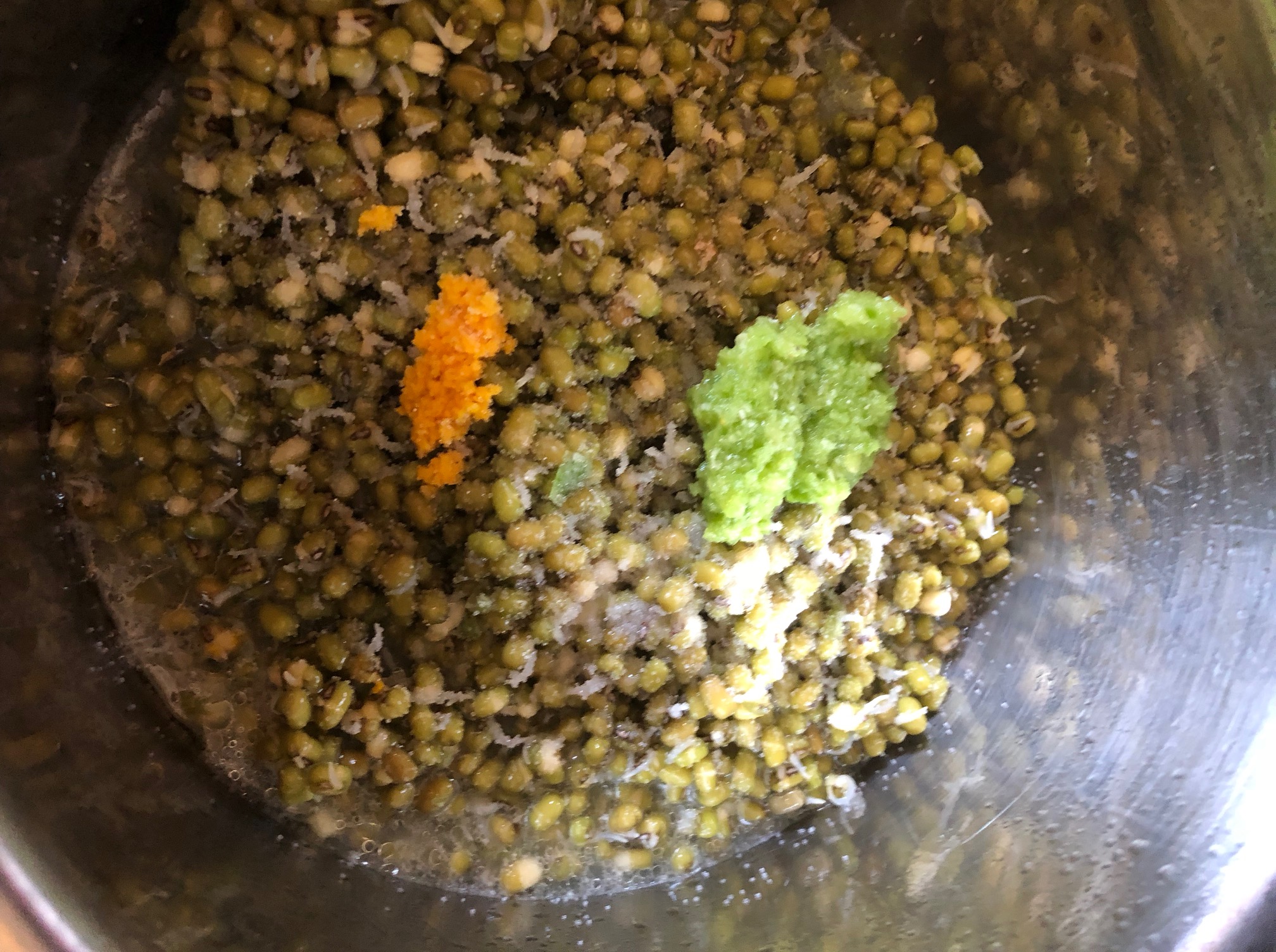 fresh turmeric and green chili and garlic added to the sprouted mung beans