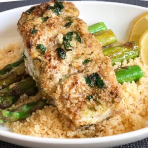 air fried almond crusted halibut on a plate with asparagus