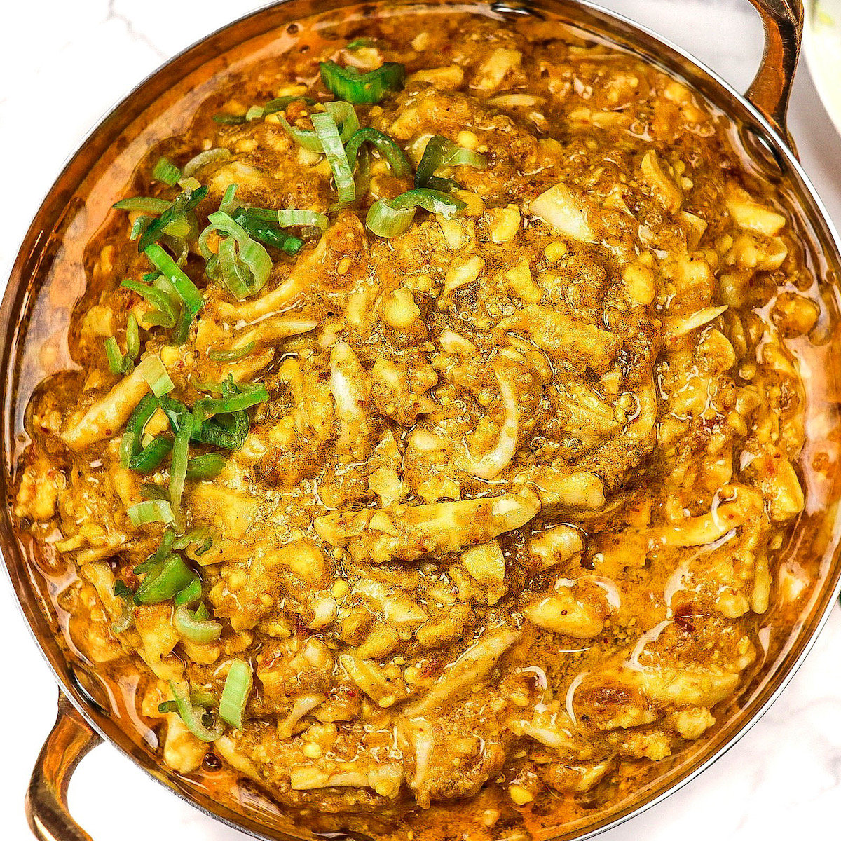 Egg Kheema in a copper pot with two handles