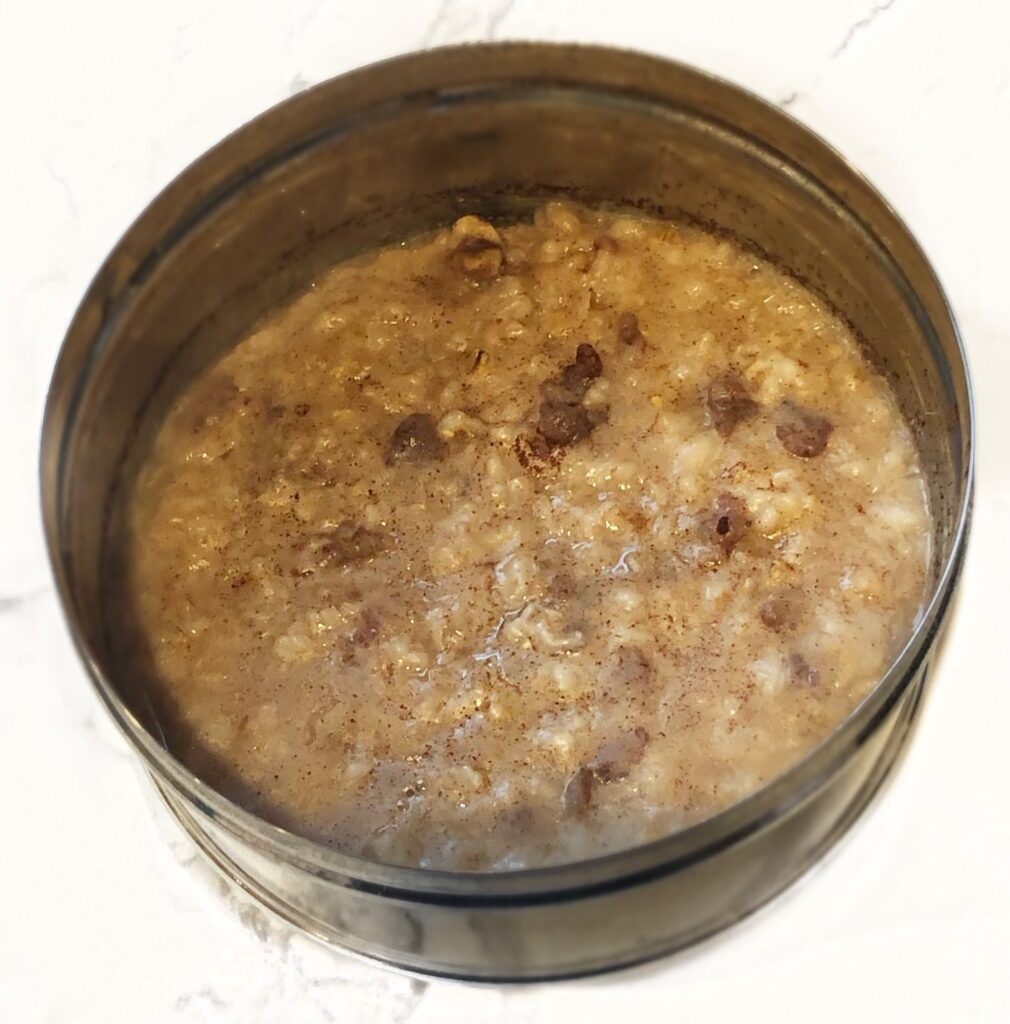 tiffin container with steel cut oatmeal with nuts and cinnamon