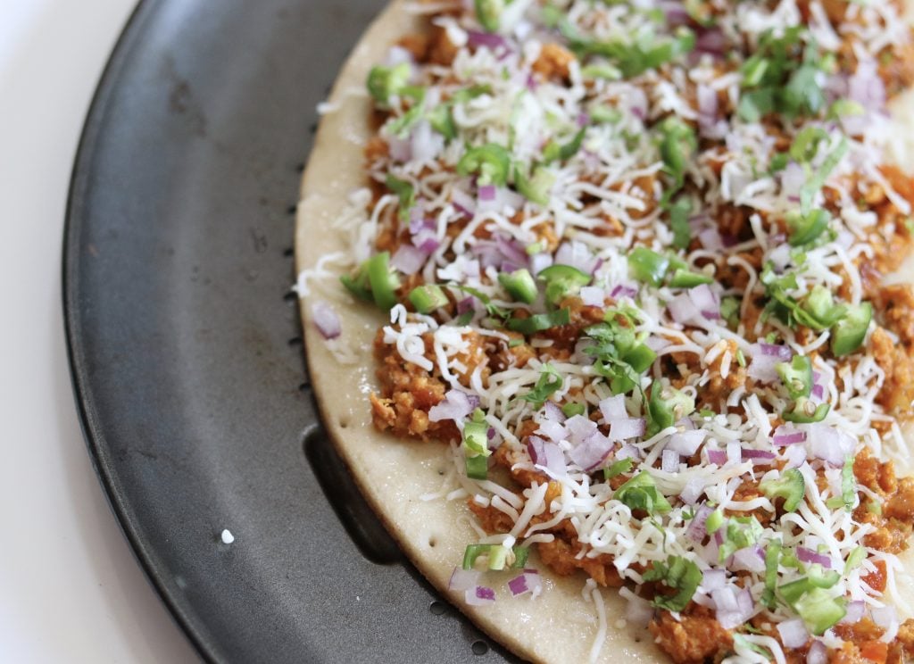 gluten free crust pizza topped with spicy minced meat.