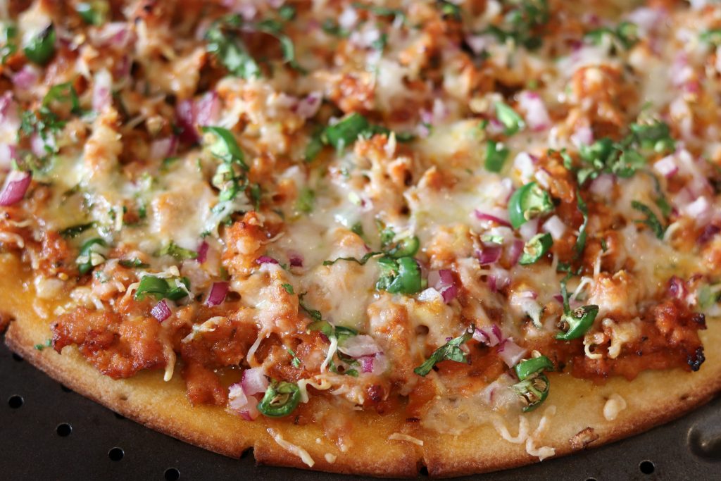 Pizza topped with spicy minced meat.