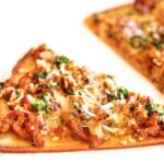 kheema pizza an indian pizza with chicken and spices on cauliflower crust