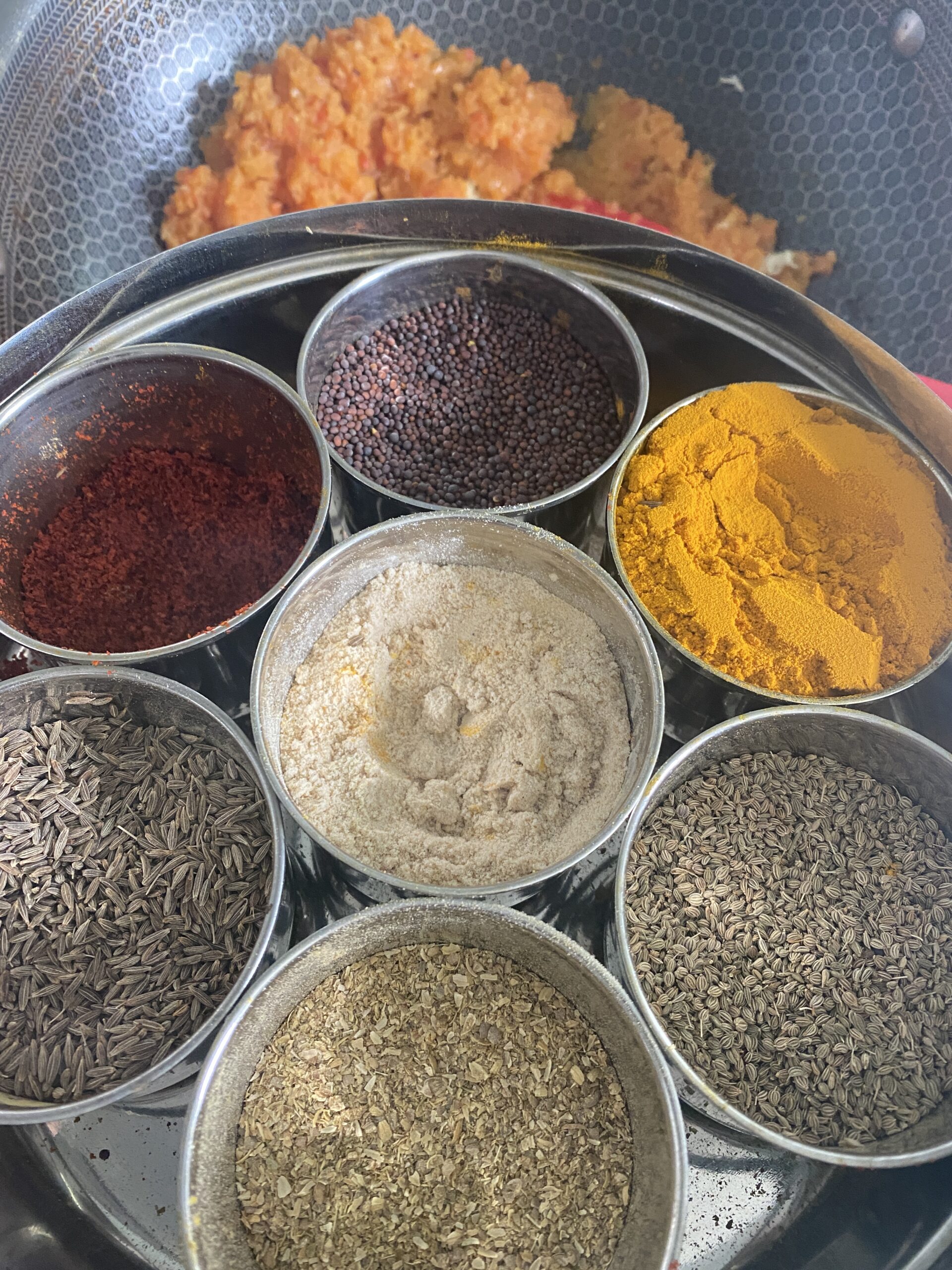 indian spices in 7 small containers