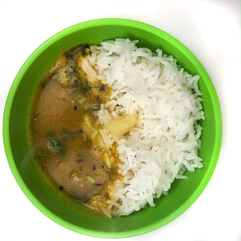 kid friendly green bowl with instant pot soup and white rice.