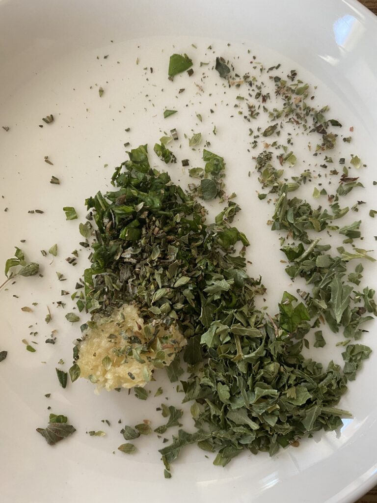 minced herbs and garlic in a bowl