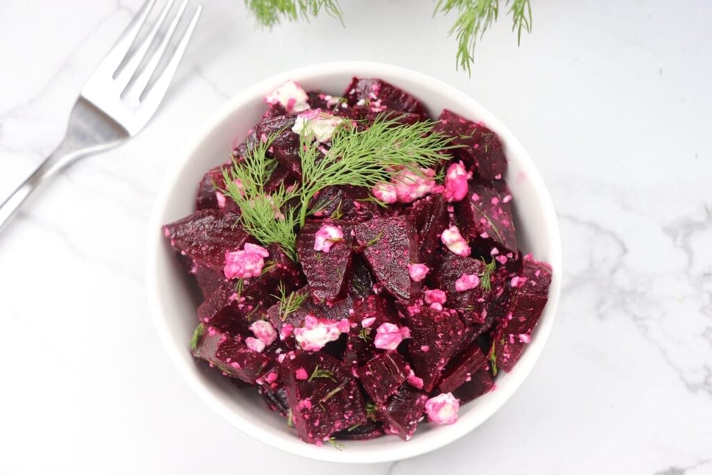 A steamed red beet salad with dill and feta cheese.