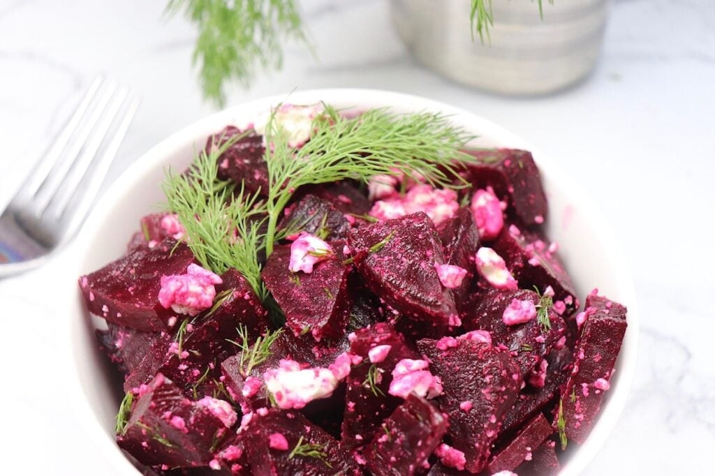 A steamed red beet salad with dill and feta cheese.