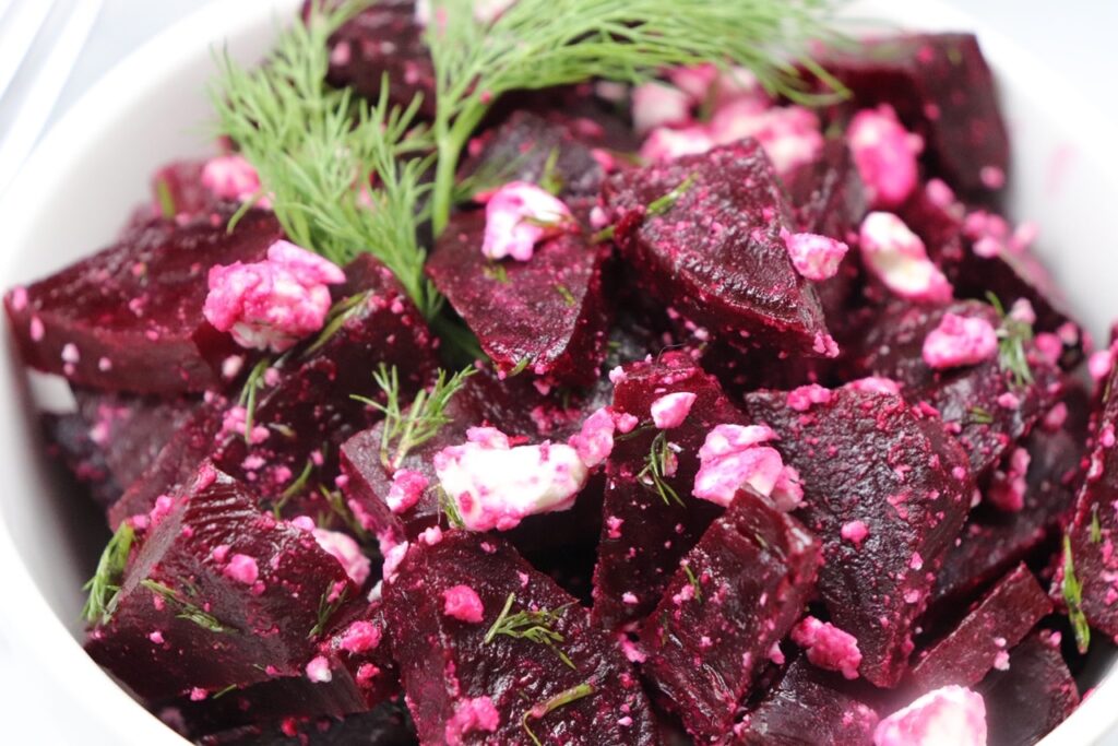 A steamed red beet salad with dill and feta cheese.