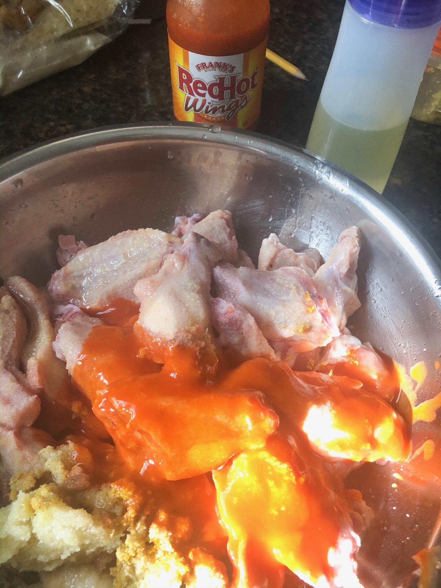hot sauce and chicken wings with garlic ginger for marinating