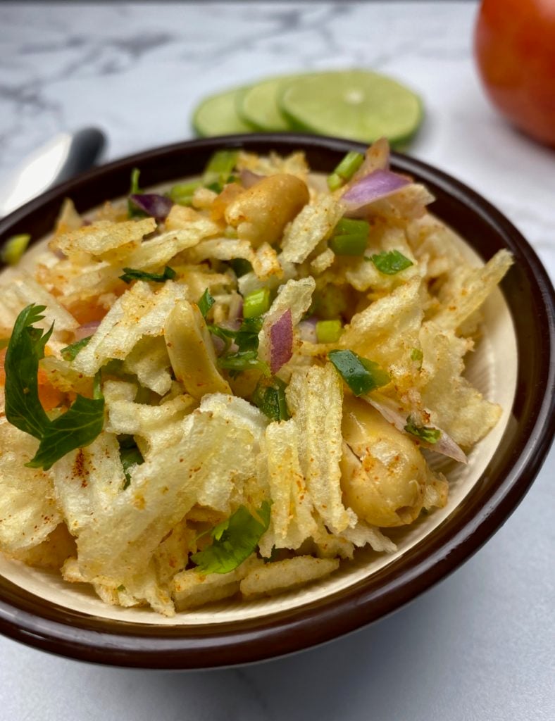 ruffle potato chips with indian salsa in a bowl