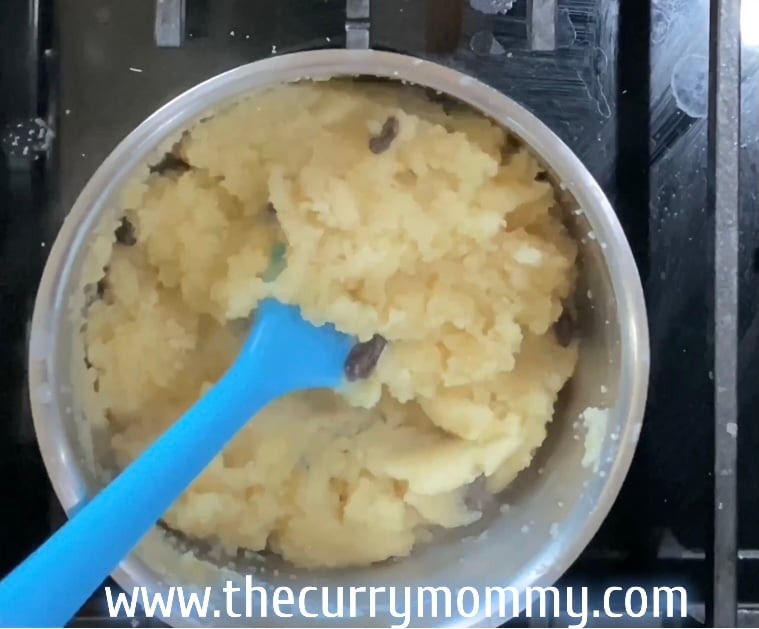 mixing halva with a blue spatula