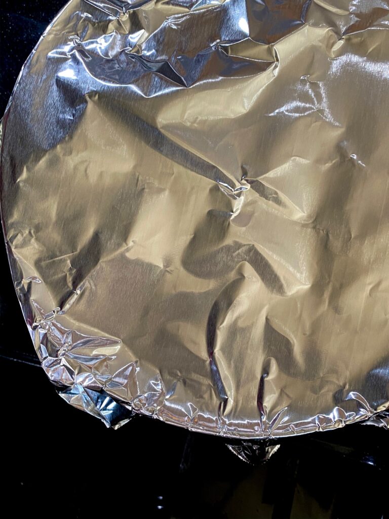 a bowl wrapped in foil paper
