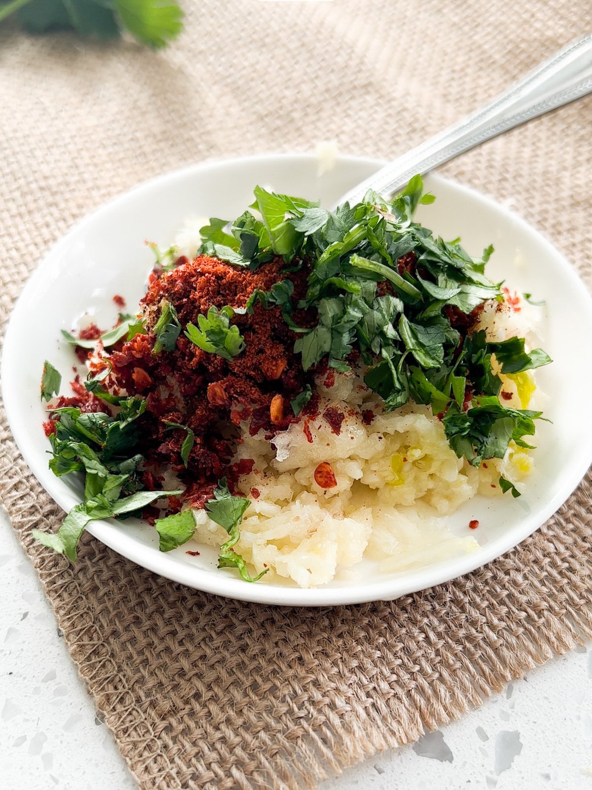 fresh garlic and red chili powder in a bowl