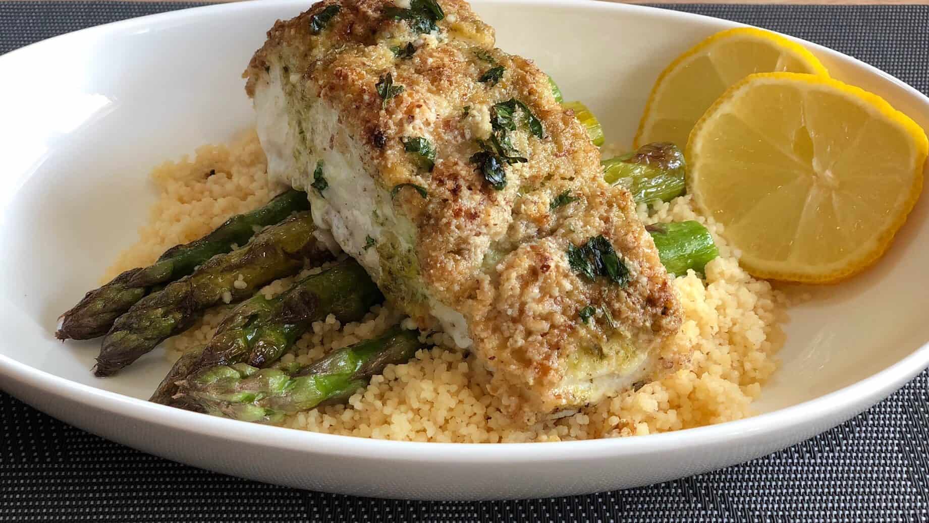 almond crusted halibut on top of asparagus 