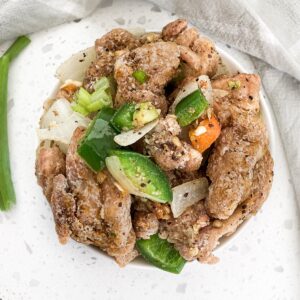 fakeaway chinese salt and pepper chicken recipe homemade in a bowl with jalapeno onion and fried chicken