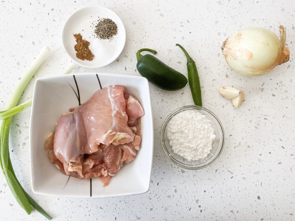 ingredients for Chinese salt and pepper chicken on a table