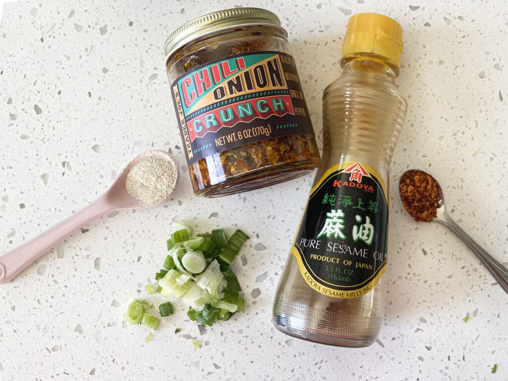 ingredients for momo chutney layed out in bottles cut scallion and spicy pepper