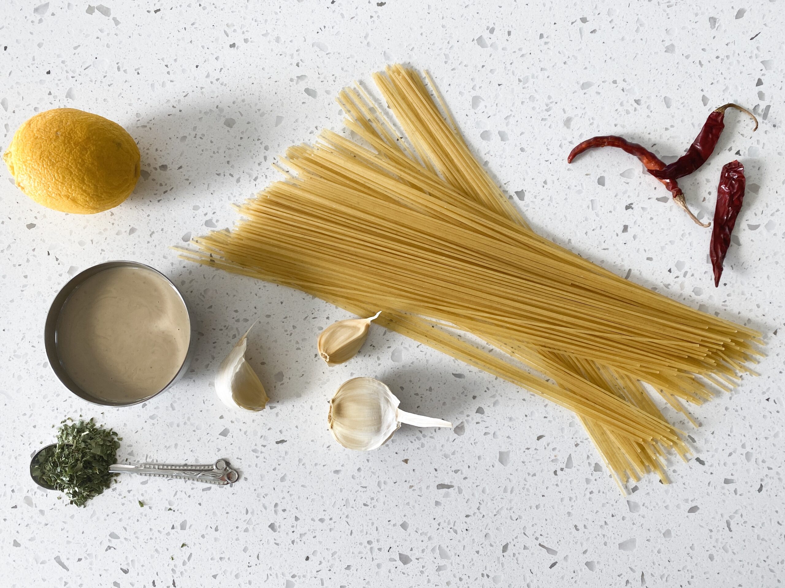 ingredients for tahini pasta on a table